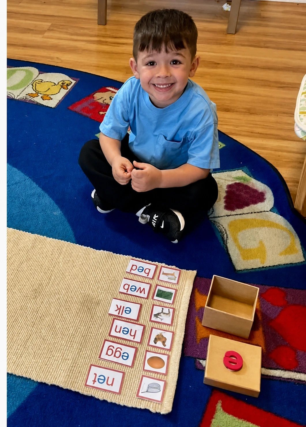 A child working with Montessori language materials at Gwillimbury Hills.